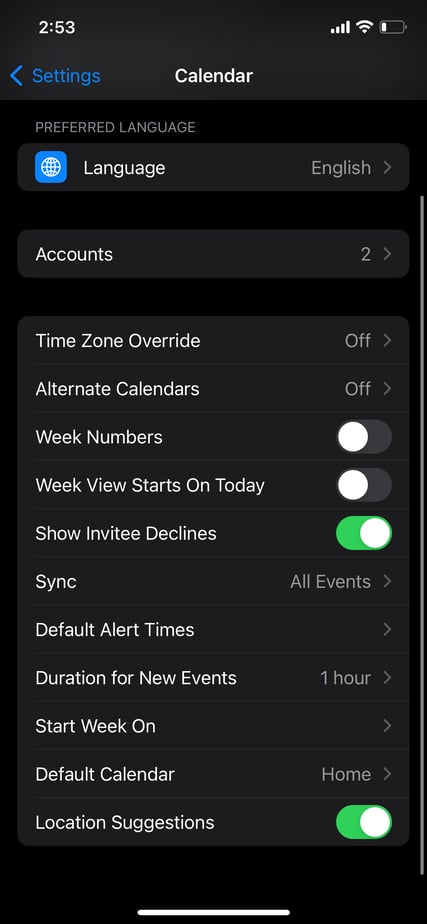 A screenshot of the Apple Calendar settings page on an iPhone. Options include managing accounts, adjusting time zone overrides, enabling week numbers, showing invitee declines, and customizing default alert times.